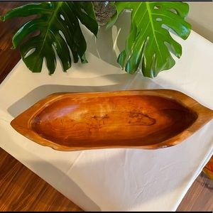 Unique wood carved elongated bowl/vessel.